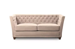 Pikowana sofa w stylu chesterfield z ozdobną lamówką Gandy